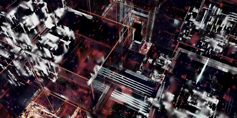 A dense circuit-like structure photographed from above, lit paths running between blocks.